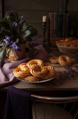 Wall Mural - eclairs or profiterole delicious pastry dessert filled with whipped cream on vintage wooden table ba