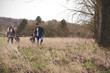 © Guerilla - Family On Winter Walk Through Field Together