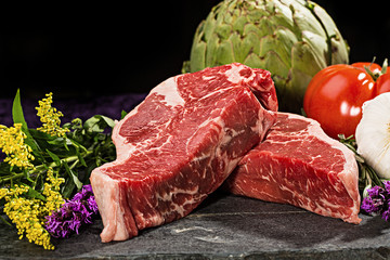 Thick cut, juicy, raw New York steaks