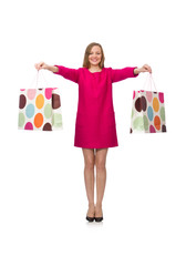 Shopper girl in pink dress holding plastic bags isolated on whit