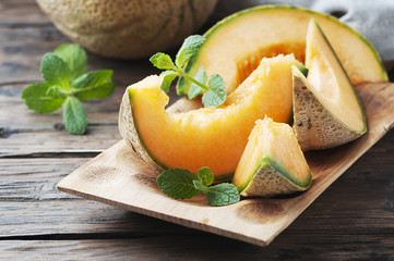 Fresh sweet orange melon and green mint