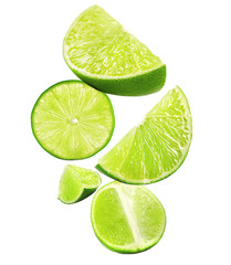 Wall Mural - Falling limes isolated on white