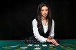 © nazarovsergey - The beautiful girl, dealer, behind a table for poker