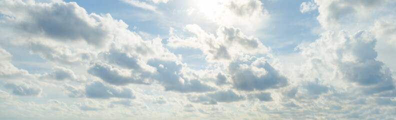 Sun light behind the cloud and blue sky