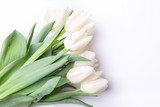 Fototapeta Tulipany - Bunch of white tulips on white background