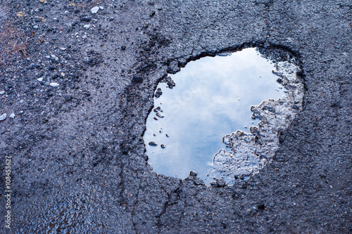 Fotomural Large deep pothole in Montreal street