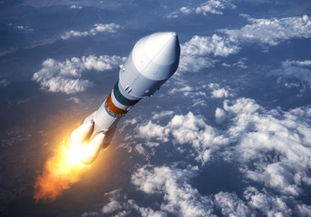 Wall Mural - cargo carrier rocket launch in the clouds