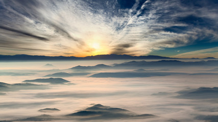 Idyllic mountain landscape at misty dawn