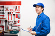 © twinsterphoto - Young male engineer at work in mechanic tools storage room