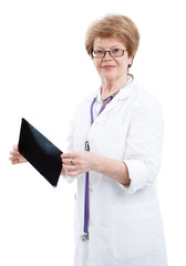 Strict woman doctor examines a radiograph isolated on white background