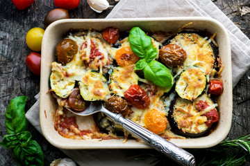 Canvas Print - Eggplant,zucchini and tomato with mozzarella in Casserole