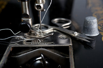 Vintage sewing machine with utensils 