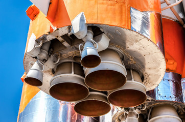 Wall Mural - detail of space rocket engine against the blue sky