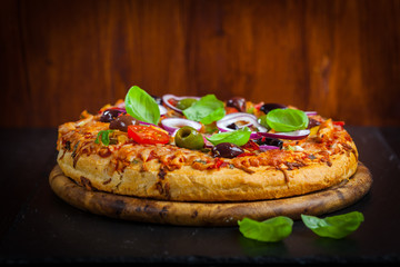 Wall Mural - Traditional homemade pizza with tomatoes and olives