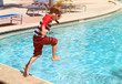 © nadezhda1906 - Little boy jumping into swimming pool