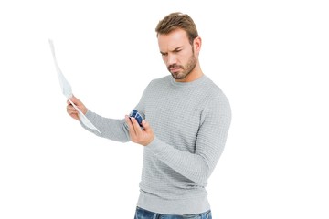 Wall Mural - Young serious man holding a map