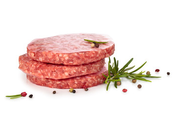 Raw hamburgers and spices.