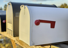White Mailbox With Red Flag Down