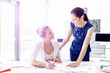 © Sergey Nivens - Two female colleagues in office