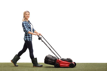 Poster - Woman mowing a lawn with a lawnmower