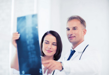 Wall Mural - two doctors looking at x-ray