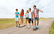 © Syda Productions - happy teenage friends with longboards outdoors