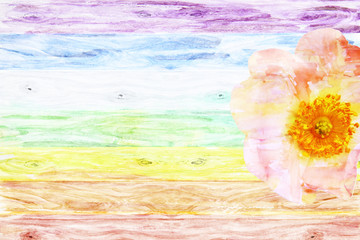 Rustic wooden background colored like a rainbow with wild rose f