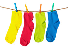 Colorful Socks Hanging On A Rope Isolated