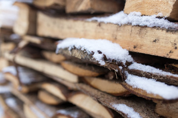 Sticker - firewood in the snow in the winter