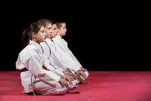 Children In Kimono Sitting On Tatami On Martial Arts Seminar. Selective Focus