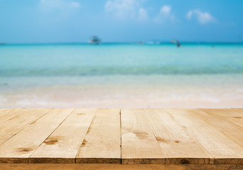 Wall Mural - image of wooden table in front of summer sea in thailand