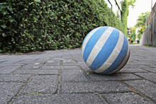 The Blue And White Soccer Ball On The Cobblestone Road Was Forgotten By Children, Kuta, Bali, Indonesia
