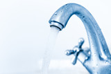 Fototapeta  - Running water tap closeup