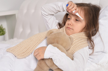 Wall Mural - sick little girl lying in the bed