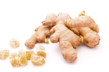 Fresh and candied ginger. Caramelized ginger candy. Isolated on white background.