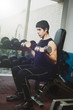 © funkyfrogstock - Man doing exercise in gym