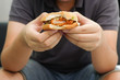 close up man hand gesture showing hamburger:fast food concept.