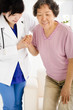 © Tom Wang - Nurse in nursing home helping senior woman stand up