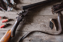 Closeup Of A Rifle On A Wood