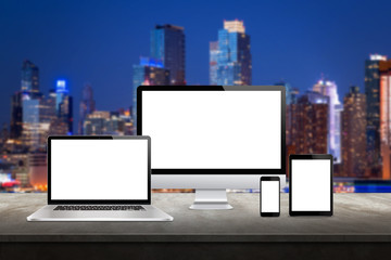 Sticker - computer display, laptop, tablet and smart phone responsive display devices on table. isolated white
