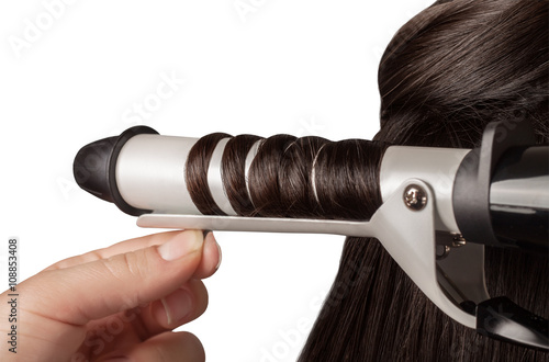 Fotografía Rizar el cabello aislado en blanco