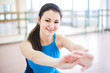 © nagaets - Woman doing stretching exercises on the floor at the gym