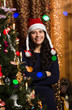 Smiling girl with Christmas tree