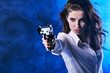 © ZoomTeam - beautiful sexy girl holding gun . smoke background