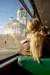 People commute during the peaceful morning on a tram passing by Helsinki Cathedral, Finland