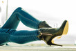 woman legs in denim pants heels shoes outdoor