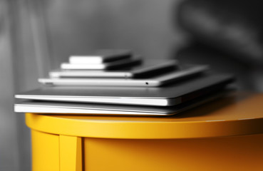 Poster - Pile of electronic gadgets on the table. Communication and technology concept