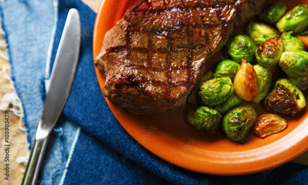 Grilled steak with vegetables, closeup