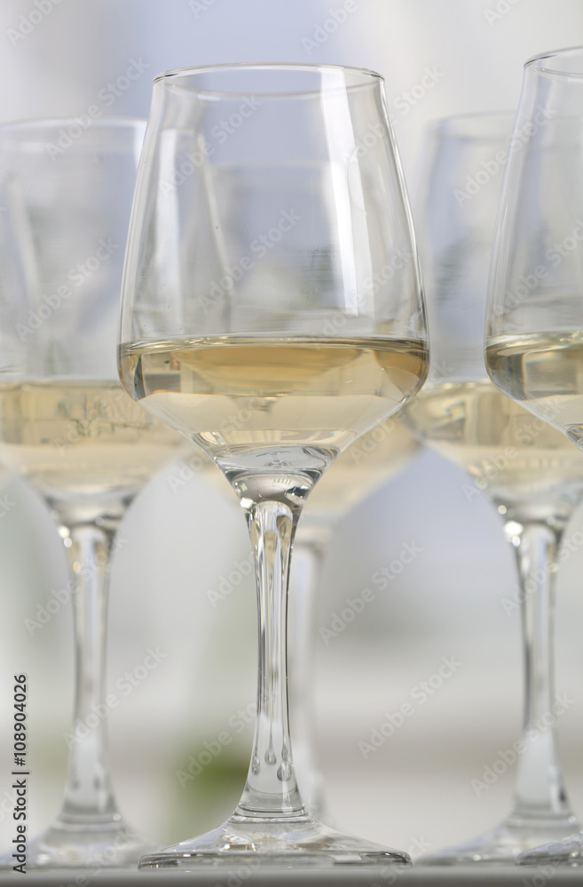 Glasses of white wine on table closeup