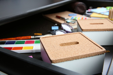 Sticker - Stationery in open desk drawer closeup